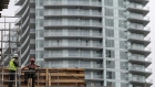 Construction workers chat on a condominium building site in Toronto, Ontario, Canada October 3, 2016