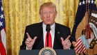 President Donald Trump gestures during a news conference in the East Room of the White House