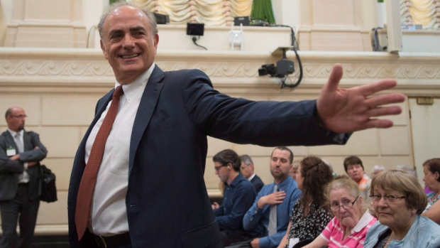 Air Canada CEO Calin Rovinescu gestures before a Commons official languages committee meeting