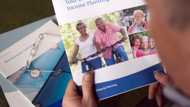 A man looks at a retirement planning brochure.