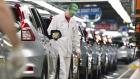 Production Associates inspect cars moving along assembly line at Honda plant in Alliston, Ont.