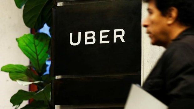 A man exits the Uber offices in Queens, New York article image