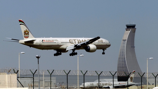 An Etihad Airways plane prepares to land at the Abu Dhabi airport travel ban