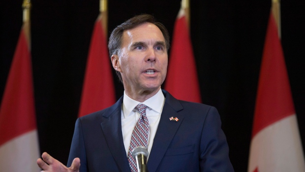 Bill Morneau speaks during a press conference at the media lock-up before tabling the federal budget