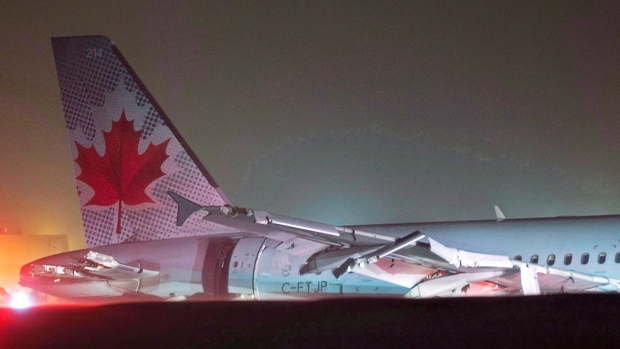 Air Canada flight 624 rests off the runway after landing at Stanfield International Airport