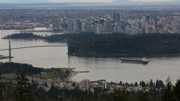  A cargo ship passes Stanley Park under the Lions Gate Bridge into the Port of Vancouver, B.C. 