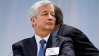 JPMorgan Chase Chairman and CEO Jamie Dimon listens as President Barack Obama speaks in 2014