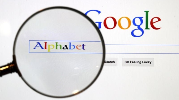 A Google search page is seen through a magnifying glass in this photo illustration