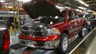 An assembly line with 2014 Ram 1500 pickup trucks at a plant in Warren, Michigan