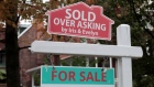 "Sold over asking" sign on display in Toronto, Ontario