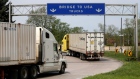 Trucks in Windsor, Ontario heading to Detroit, Michigan