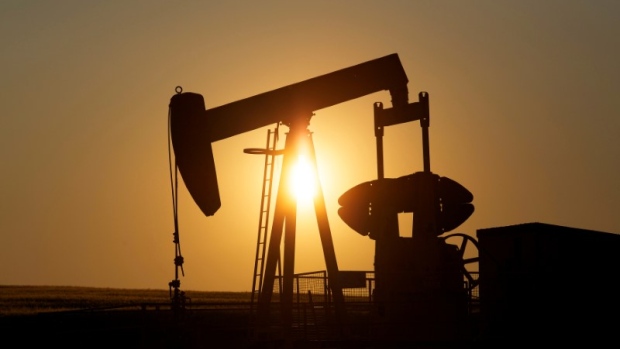 An oil pump jack pumps oil in a field near Calgary, Alberta, Canada on July 21, 2014