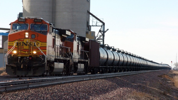 This Nov. 6, 2013, file photo, shows a BNSF Railway train hauling crude oil near Wolf Point, Mont. 