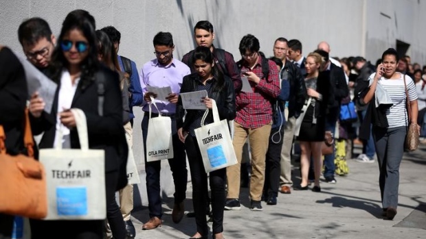 People wait in line to attend TechFair LA, a technology job fair, in Los Angeles, California