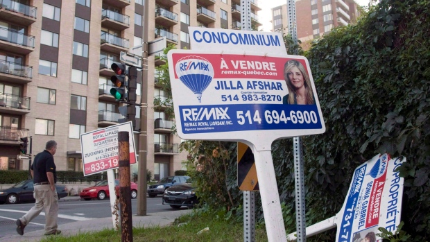 A real estate signs stand in front of a condo September 27, 2011 in Montreal. Montreal real estate