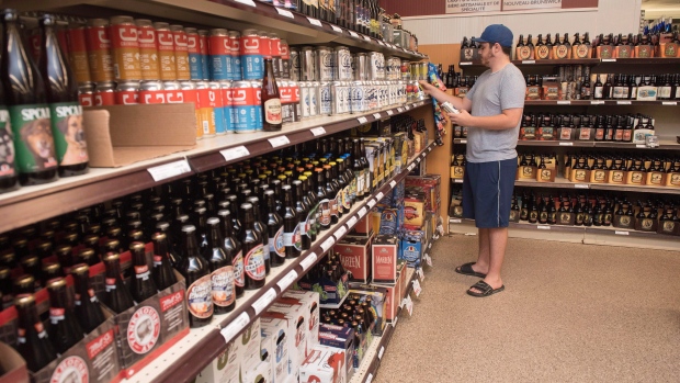 A customer shops in the craft beer section in Fredericton, N.B., on Friday, June 16, 2017
