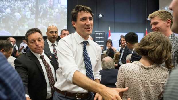 Justin Trudeau greets guests he leaves leaves a New York Times panel discussion in Toronto 