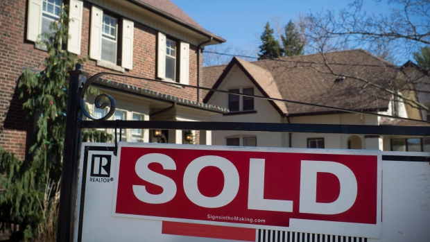A sold sign is shown in front of west-end Toronto homes