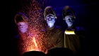 Blue Man Group performs with paint during a media preview on Thursday, March 31, 2016