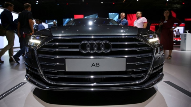 Attendees view the Audi A8 at the Audi Summit in Barcelona, Spain July 11, 2017