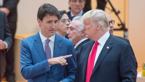 Prime Minister Justin Trudeau, left, speaks to United States President Donald Trump