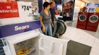 Customers enter the appliance department at a Sears store in Niles, Ill.
