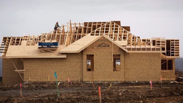 Builders work on a new home in the Beacon Hills area of Fort McMurray