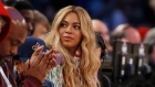 Beyonce sits at court side during the second half of the NBA All-Star basketball game in New Orleans