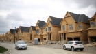 A row of houses under construction are seen at a subdivision near the town of Kleinburg, Ontario