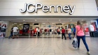 Shoppers walk into a J.C. Penney department store in Hialeah, Fla.