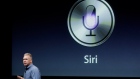 Apple's Phil Schiller talks about Siri during an announcement at Apple headquarters in Cupertino
