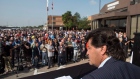Unifor National President Jerry Dias waits for Bombardier workers to assemble