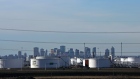 Enbridge's facility in Sherwood Park are seen against the skyline of Edmonton, Alberta