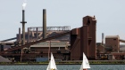 Sailboats make their way past part of the Stelco plant in Hamilton, Ont. Friday July 23, 2004