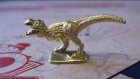 A T-Rex Monopoly piece.