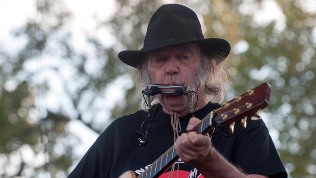 Neil Young performs at the Harvest the Hope concert in Neligh, Neb. on Saturday, Sept. 27, 2014. 