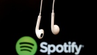 FILE PHOTO: Headphones are seen in front of a logo of online music streaming service Spotify in this illustration picture