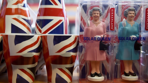 Figures of Britain's Queen Elizabeth are displayed for sale in a shop in central London