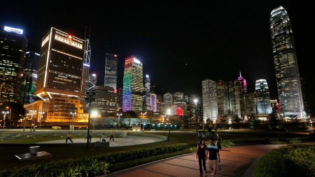High-rise commercial buildings are lit up at night in Hong Kong, July 31, 2014