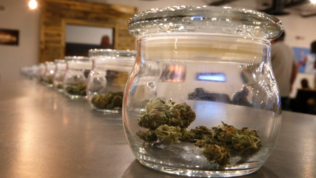 Weed for sale is kept in jars for customers to sample smells, at a recreational marijuana store