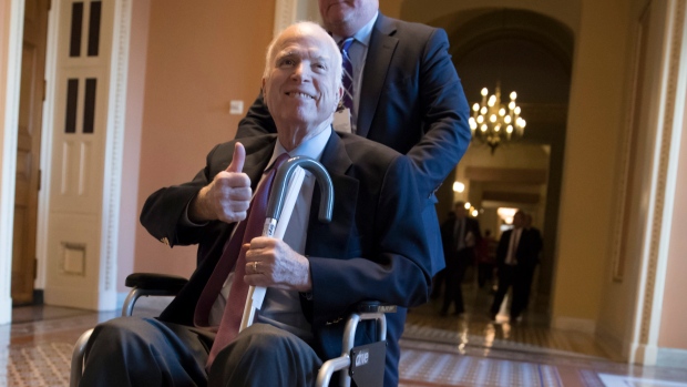 In this Dec. 1, 2017 file photo, Sen. John McCain, R-Ariz., leaves a closed-door session where Repub