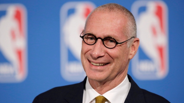 In this Oct. 6, 2014 photo, ESPN President John Skipper smiles during a news conference in New York