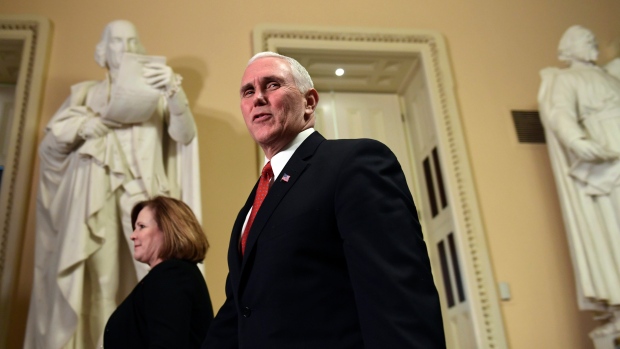 Vice President Mike Pence walks on Capitol Hill in Washington,