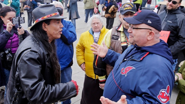 Philip Yenyo executive director of the American Indians Movement for Ohio talks with a Cleveland fan