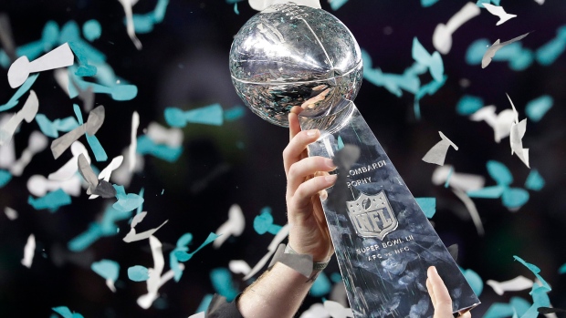 Philadelphia Eagles' Carson Wentz holds up the Vince Lombardi Trophy after NFL Super Bowl 52.