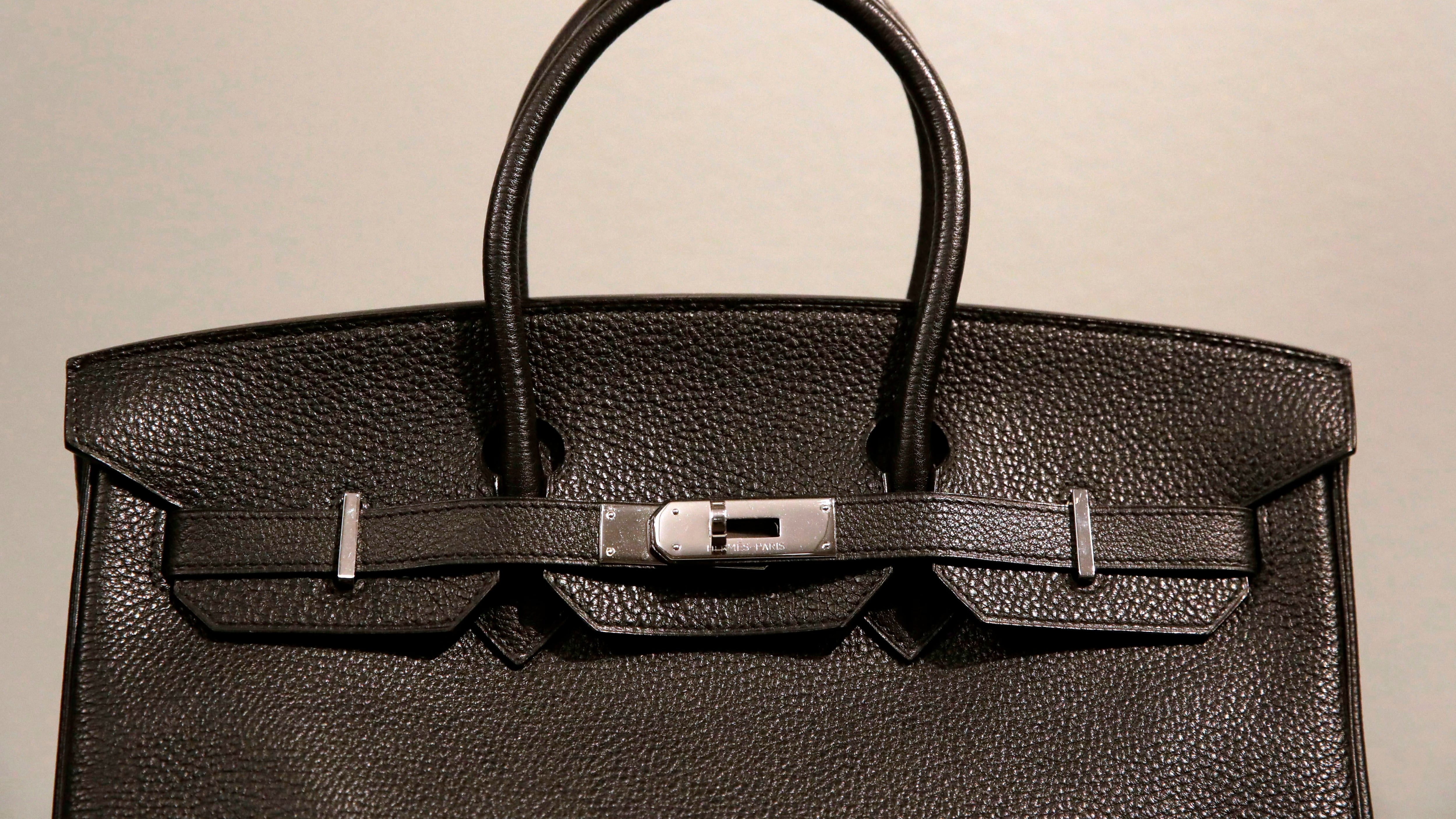 A counterfeit Hermes Birkin luxury handbag is displayed during a press preview of "Treasures on Trial: The Art and Science of Detecting Fakes" at the Winterthur Museum in Wilmington, Del., on March 29, 2017. (Patrick Semansky / AP Photo)
