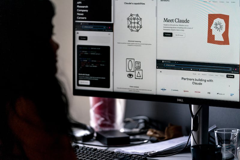 A person uses a computer, which is displaying Anthropic's website for its "Claude" AI  product, in a photo illustration made in Toronto on June 4, 2024. (Giordano Ciampini / The Canadian Press)