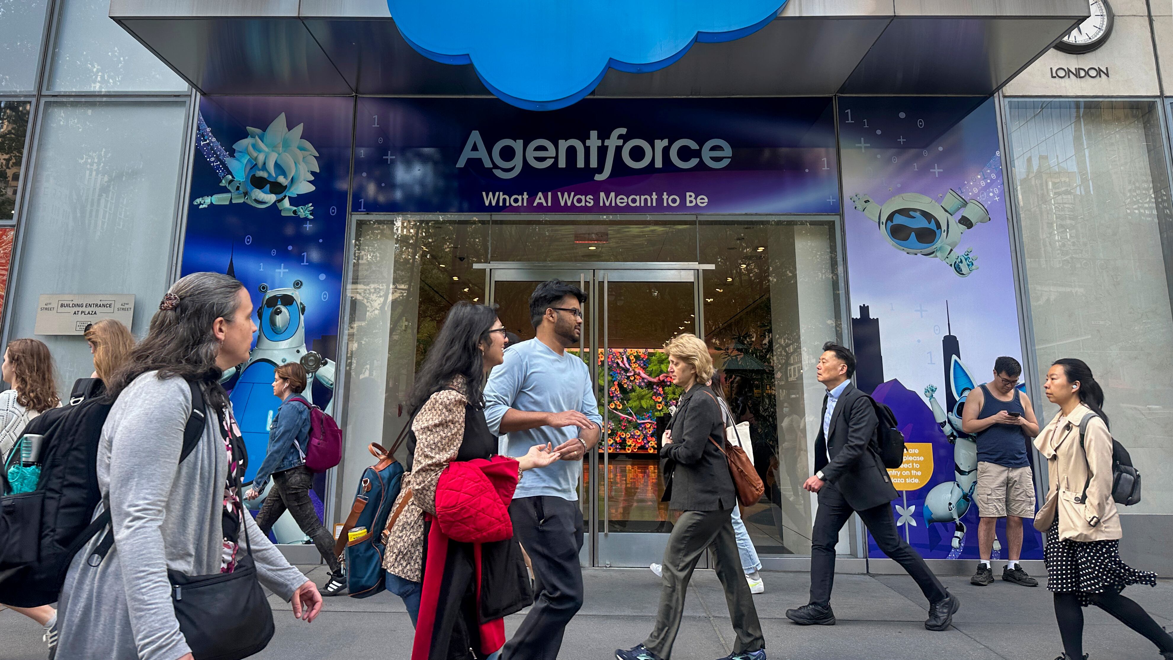 People walk past the Salesforce Tower in New York on Thursday, May 8, 2025. (AP Photo/Ted Shaffrey, File)