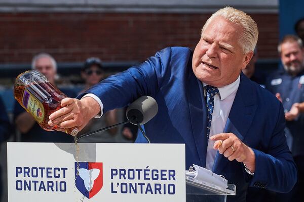 Doug Ford dumps bottle of Crown Royal, lashing out at brand over moving jobs to U.S.