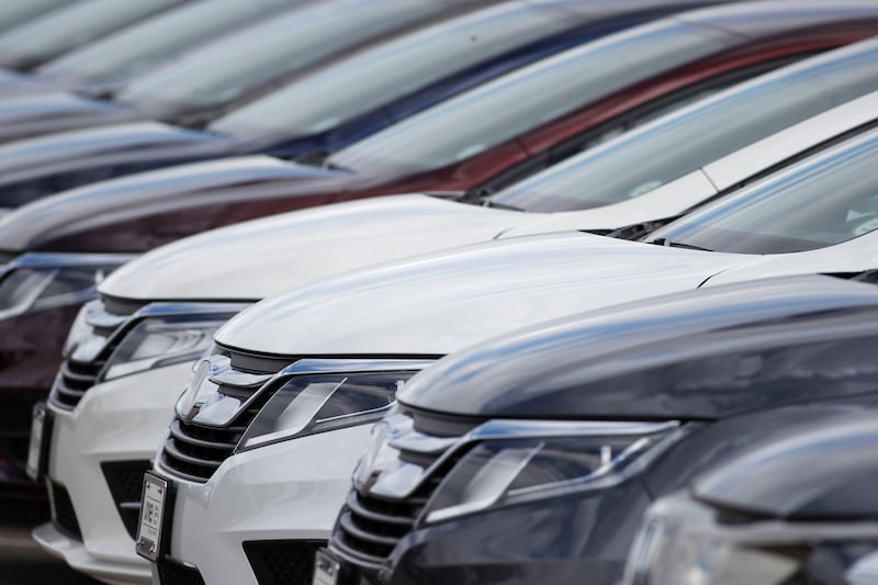 A long row of unsold 2020 Odyssey minivans sits at a Honda dealership in Highlands Ranch, Colo on April 5, 2020.